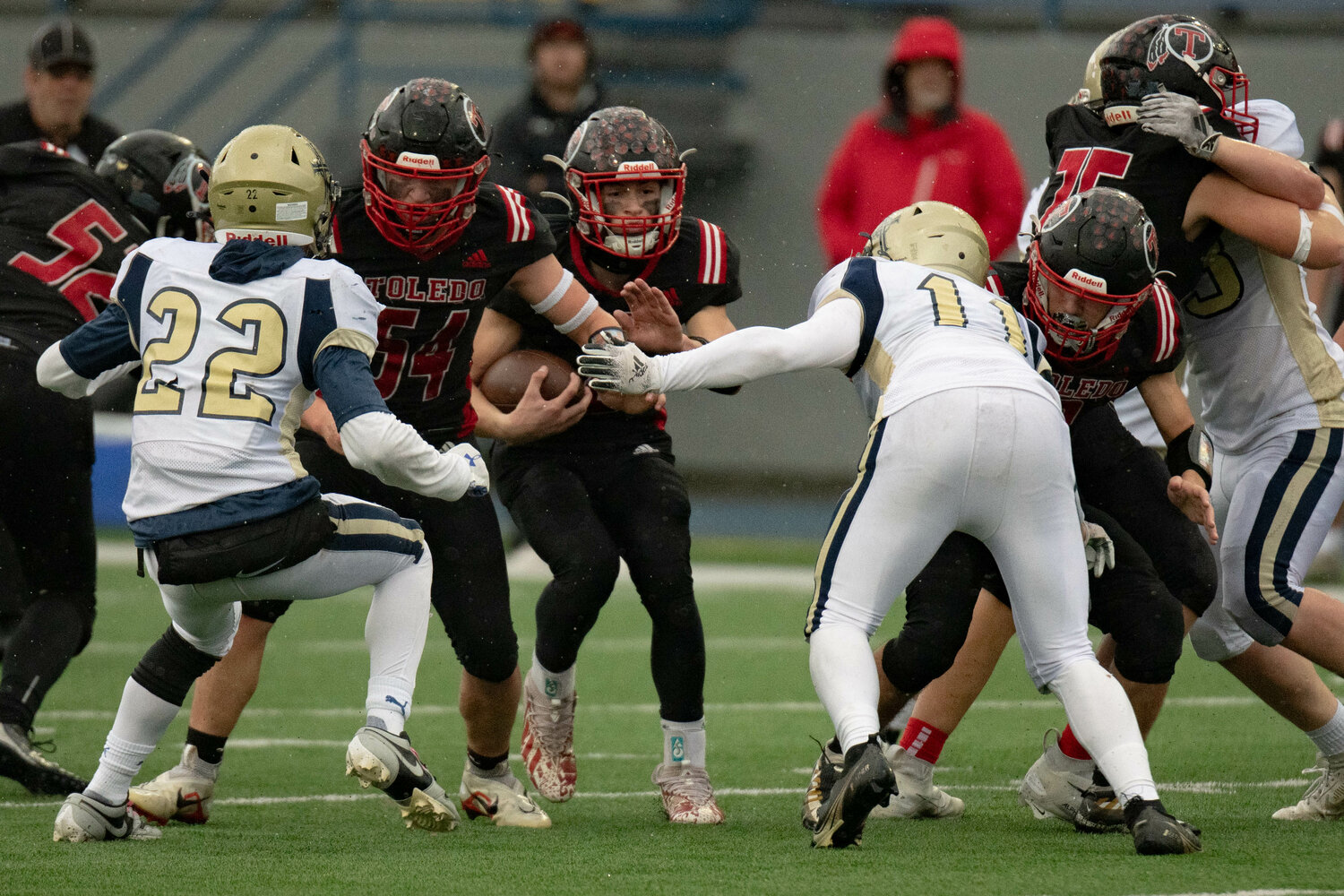 Toledo's Eli Weeks rushes downfield  during a 21-12 win over Tri Cities Prep Nov. 11.